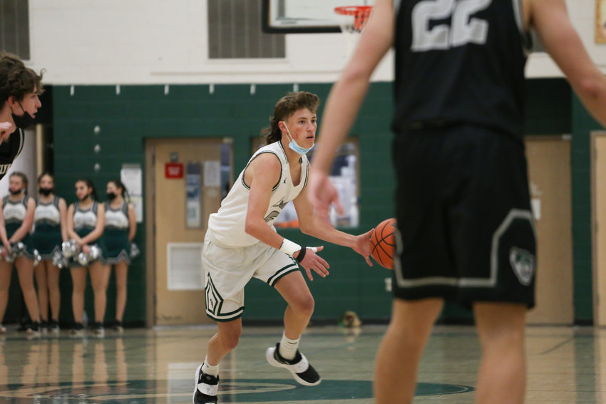Conifer's Mason Pratt dribbles the ball during a game in the 2021-22 season. Pratt, who also plays baseball for Conifer, hopes to play baseball at the collegiate level.